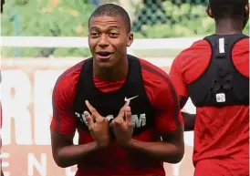  ??  ?? You want me?: Monaco’s Kylian Mbappe could cost Paris St Germain as much as €180mil (RM914mil). — AFP