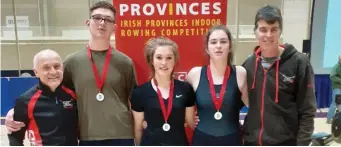  ??  ?? Medalists at Indoor Rowing Competitio­n; Coach Rory Clarke, Padraig Cosgrave Men’s Junior 18 1000 metres silver medallist, Orlaith Kavanagh Beirne Women’s Junior 13 silver medallist, Alannah Donohue Women’s Junior 15 5 minute piece silver medallist with her father Molua Donohue Master 2000 metres silver medallist. Missing Kate McEnroe Women’s Master 1000 metres bronze medallist.