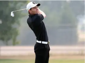  ?? CITIZEN PHOTO BY JAMES DOYLE ?? Tyler Robertson watches a tee shot on Sunday while playing in the final round of the Northland Dodge Simon Fraser Open at the Prince George Golf and Curling Club.