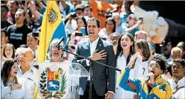  ?? ARIANA CUBILLOS/AP ?? Opposition leader Juan Guaido sings the national anthem Tuesday in Caracas.