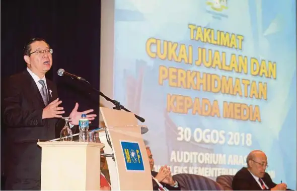  ?? HAMZAH PIC BY MOHD FADLI ?? Finance Minister Lim Guan Eng speaking during a media briefing on the Sales and Services Tax in Putrajaya yesterday.