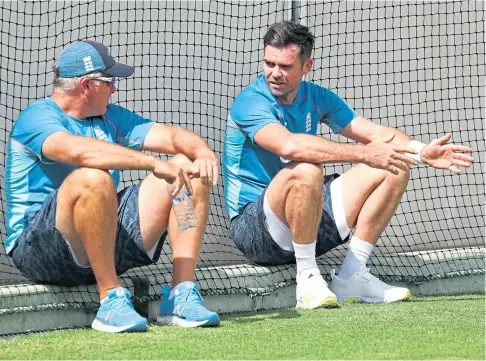  ?? ?? FIELD WORK: England Coach Chris Silverwood, left, talks to James Anderson at the Gabba in Brisbane.