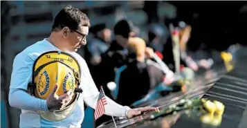  ?? DREW ANGERER/GETTY ?? James Taormina, whose brother Dennis died in the 9/11 attacks, pauses Monday before a ceremony in New York City.