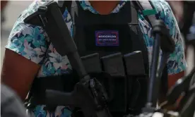  ??  ?? An armed protester wearing a Hawaiian shirt and a ‘boogaloo’ badge at a rally for second amendment gun rights near the state capitol in Richmond, Virginia, 4 July 2020. Photograph: Jonathan Ernst/Reuters