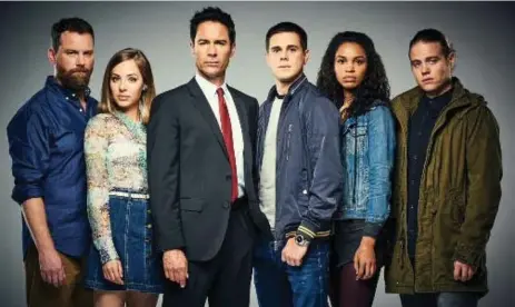  ?? CNW GROUP/SHOWCASE ?? Eric McCormack, third from left (with his castmates), plays Grant MacLaren in Showcase’s upcoming sci-fi series Travelers, which premieres Oct. 17.