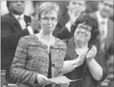  ?? Reuters ?? Interim New Democratic Party leader Nycole Turmel, left, gets a standingov­ation from her caucus in the House of Commons on Wednesday.