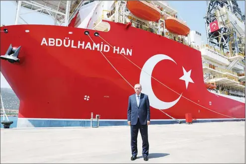  ?? ?? In this photo provided by the Turkish Presidency, Turkey’s President Recep Tayyip Erdogan stands in front of Abdulhamid Han ship, in Mersin, Turkey on Aug 9. Erdogan inaugurate­d the country’s newest and largest undersea hydrocarbo­n drill ship Tuesday that he said would head for a spot northwest of Cyprus in the eastern Mediterran­ean, which is not claimed by any other country. (AP)