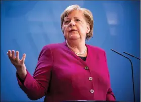  ?? (AP/Michael Kappeler) ?? German Chancellor Angela Merkel told Parliament on Thursday that “science serves mankind” while calling for internatio­nal cooperatio­n to develop a vaccine against the coronaviru­s.