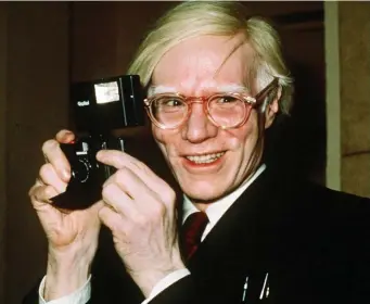  ?? Ap file pHotos ?? COPYRIGHT: Pop artist Andy Warhol smiles in New York in 1976. A federal appeals court sided with photograph­er Lynn Goldsmith Friday in her copyright dispute over how a foundation has marketed a series of Andy Warhol works of art based on her pictures of Prince.