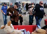  ?? ?? Ron Becker from Herbert donates a teddy bear and other toys during the Toy Run, Sept. 17.