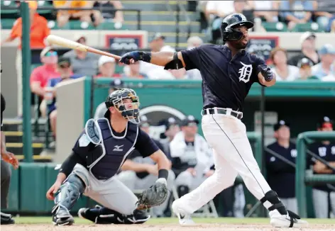  ?? LYNNE SLADKY/THE ASSOCIATED PRESS ?? Christin Stewart follows through on a grand slam against the Yankees in a spring-training game last week.