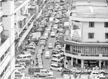  ??  ?? The traffic congestion in Kota Kinabalu is aggravated by problems of road design and maintenanc­e in the city.