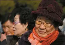  ?? Korea Times photo by Choi Won-suk ?? Kim Jeom-rae, right, whose 24-year-old son was gunned down by soldiers during the May 18 Democratic Uprising, visited the Gwangju District Court on Jan. 7 to attend the second criminal trial session for Chun Doo-hwan, who is charged with defamation.