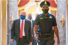  ?? CAROLYN KASTER/ASSOCIATED PRESS ?? Postmaster General Louis DeJoy, left, is escorted to House Speaker Nancy Pelosi’s office on Capitol Hill in Washington earlier this month. Dejoy will testify next Monday before Congress.