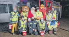  ?? Picture: Mike Cooter ?? CHEER Jasper Taylor (centre, back row) and the team of volunteers from Portcheste­r Fire Station