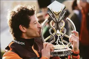  ?? Christophe­r Furlong / Getty Images ?? Winning jockey Sam Waley-Cohen celebrates with the Grand National Trophy after riding Noble Yeats to victory in the Grand National on Saturday.