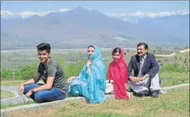  ?? AFP ?? Malala Yousafzai (second from right) with her family during her visit to the Swat Valley.