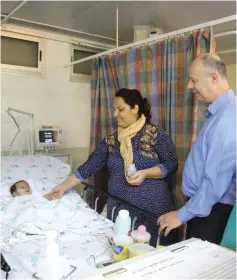  ?? (Courtesy Regional Cooperatio­n Ministry) ?? REGIONAL COOPERATIO­N MINISTER Tzachi Hanegbi visits a mother and child at the Wolfson Medical Center in Holon yesterday.