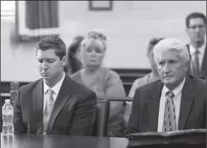  ?? Associated Press ?? Mistrial: Former University of Cincinnati police officer Raymond Tensing, left, and his attorney Stew Mathews listen as Hamilton County Common Pleas Judge Leslie Ghiz declares a mistrial on Friday in Cincinnati. Tensing was charged with murder and...