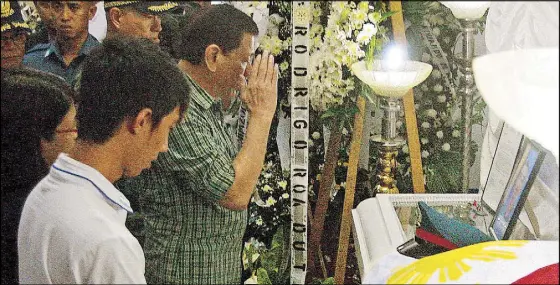  ?? JOVEN CAGANDE ?? President Duterte salutes Police Officer 1 Ralph Jason Vida upon visiting the lawman’s wake in Naga City, Camarines Sur last night. Vida was one of three police officers killed during the ambush on Food and Drug Administra­tion chief Nela Charade Puno on Oct. 18, reportedly by New People’s Army guerrillas.