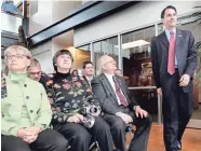  ?? JOURNAL SENTINEL FILES ?? Llewellyn Scott Walker looks on as his son, Scott Walker, then the Milwaukee County executive, walks past to give an address at the Milwaukee County Zoo in 2007.