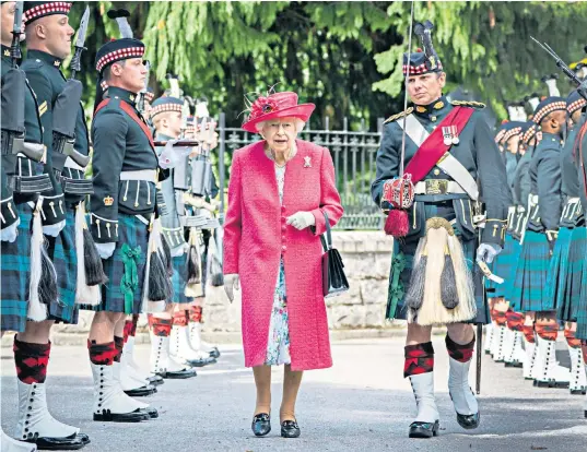  ??  ?? The Queen inspects soldiers from Balaklava Company, 5th Battalion the Royal Regiment of Scotland