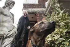  ??  ?? Tanya Grossi and her dog Enzo outside the entrance to her west-end home.