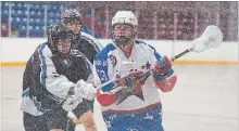  ?? BOB TYMCZYSZYN THE ST. CATHARINES STANDARD ?? Niagara’s Ken Baker-Printup, left, checks Welland’s Brock Parker in junior B lacrosse action. The Welland Generals finished the 2018 season out of the playoffs with a 1-19 record.