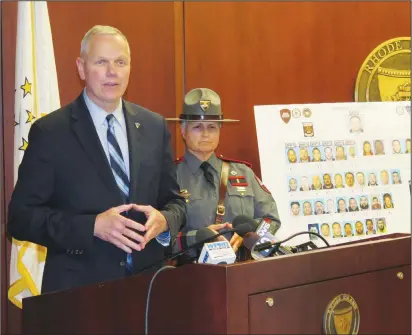  ??  ?? Lt. Col. Joseph Philbin, of the Rhode Island State Police, flanked by Col. Ann Assumpico, explains operation ‘Patched Out’ which netted several arrests, illegal drugs and weapons. Joseph B. Nadeau photos