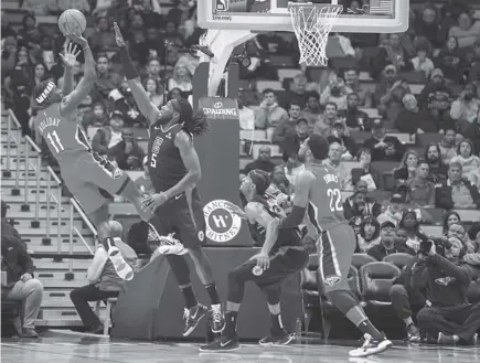  ?? AP Photo ?? MAIN MAN. New Orleans Pelicans guard Jrue Holiday (11) scores against the Los Angeles Clippers during the first half of an NBA basketball game in New Orleans.