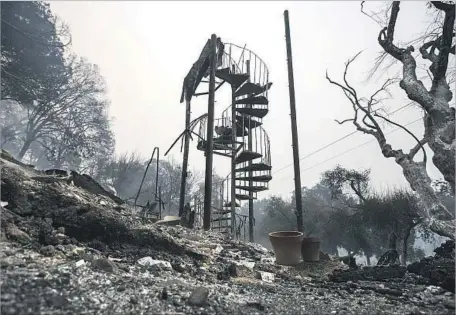  ?? Brian van der Brug Los Angeles Times ?? A STAIRWELL in the ruins of the Olea Hotel in Glen Ellen, Calif., on Oct. 10. The recent wildfires destroyed more than 8,000 buildings.