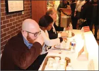  ?? (Democrat-Gazette file photo/Helaine R. Williams) ?? Judges sample eggnog offerings at the 2019 Nog-Off at Little Rock’s Historic Arkansas Museum.