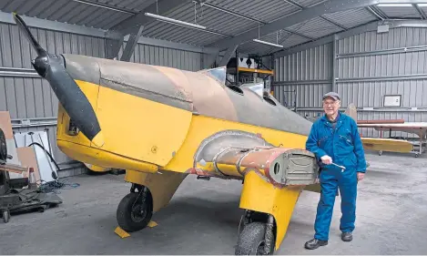  ?? Picture: Paul Reid. ?? Volunteer Andy Lawrence with the aircraft that has enjoyed a colourful history since the 1930s.