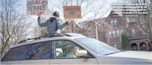  ?? GLEN STUBBE/STAR TRIBUNE VIA AP ?? Activists, who stayed mostly in their cars for social distancing, call for the release of ICE detainees outside the Governor’s Residence in St Paul, Minn.