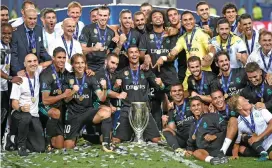  ?? (AFP) ?? Real Madrid players celebrate after winning the UEFA Super Cup in Skopje, Macedonia on Tuesday