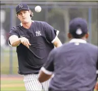  ?? Frank Franklin II / Associated Press ?? The New York Yankees’ Gerrit Cole throws during a drill at a spring training workout in February in Tampa, Fla.