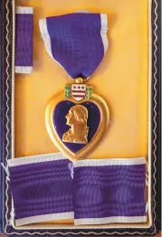  ?? EDDIE MOORE/JOURNAL ?? The Purple Heart awarded posthumous­ly to Frank Sarracino, a Laguna Pueblo man who served with the Army and died during World War II.