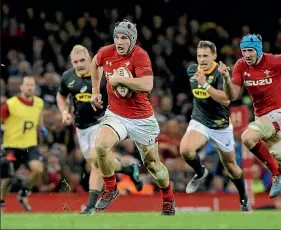  ?? AP ?? Wales wing Jonathan Davies makes a break during their win over South Africa last Sunday.