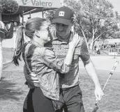  ?? Michael Thomas / Associated Press ?? Jordan Spieth hugs his wife, Annie Verret, after winning the Valero Texas Open in San Antonio.