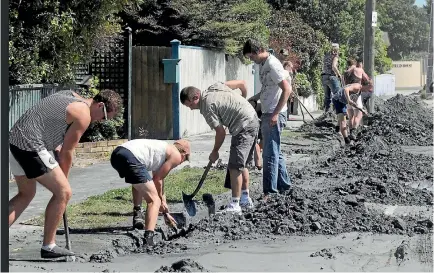  ?? PHOTO: STUFF ?? Student volunteers helping to clean up silt liquefacti­on in Barrington St in 2011.