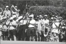  ?? MATT YORK/AP ?? FANS WATCH TIGER WOODS on the seventh hole during a practice round for the PGA Championsh­ip tournament on Wednesday in Tulsa, Okla.