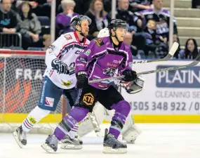  ??  ?? Battle stations Opposing players go for goal. Picture: Al Goold