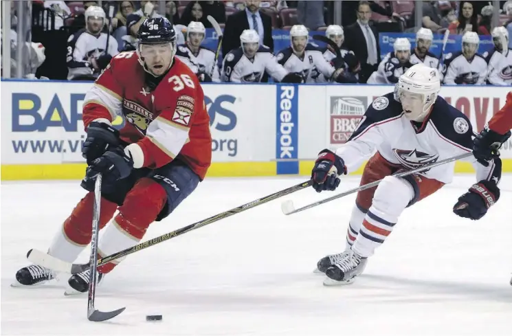  ?? LYNNE SLADKY/THE CANADIAN PRESS ?? Former Florida Panthers forward Jussi Jokinen, left, has signed a one-year contract with the Edmonton Oilers after the Panthers bought out his contract.