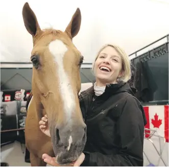  ?? LEAH HENNEL/ CALGARY HERALD ?? Canadian Tiffany Foster and her horse, Southwind, in the barns at Spruce Meadows in Tuesday. “This is probably one of the final observatio­n trials” before next summer’s Rio Games, she says.