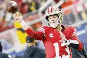  ?? ?? San Francisco 49ers quarterbac­k Brock Purdy warms up ahead of an NFC Divisional Round playoff game against the Packers on Saturday.