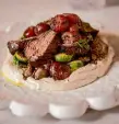  ?? ?? A shish kebab features lacquered hanger steak and roasted grapes in a bone marrow salsa along with maitake mushrooms, Brussels sprouts and hummus.