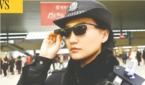  ?? AFP / GETTY IMAGES FILES ?? A police officer wears a pair of smartglass­es with a facial recognitio­n system at Zhengzhou East Railway Station in Zhengzhou, China.