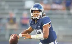  ?? Stew Milne / Associated Press ?? UConn QB Tyler Phommachan­h has been getting plenty of support and advice from his older brother Taisun, a QB at Clemson.