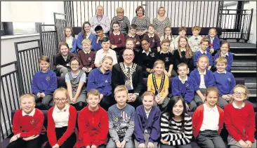  ??  ?? Schoolchil­dren learned about democracy and being a local councillor thanks to sessions held at The Hub and organised by Hinckley and Bedworth Borough Council. Alongside the children who took part is mayor Councillor Richard Allen as well (back row,...