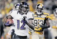  ?? Don Wright / Associated Press ?? Baltimore’s Jacoby Jones puts the Ravens on top by returning a punt 63 yards for a touchdown late in the first quarter.